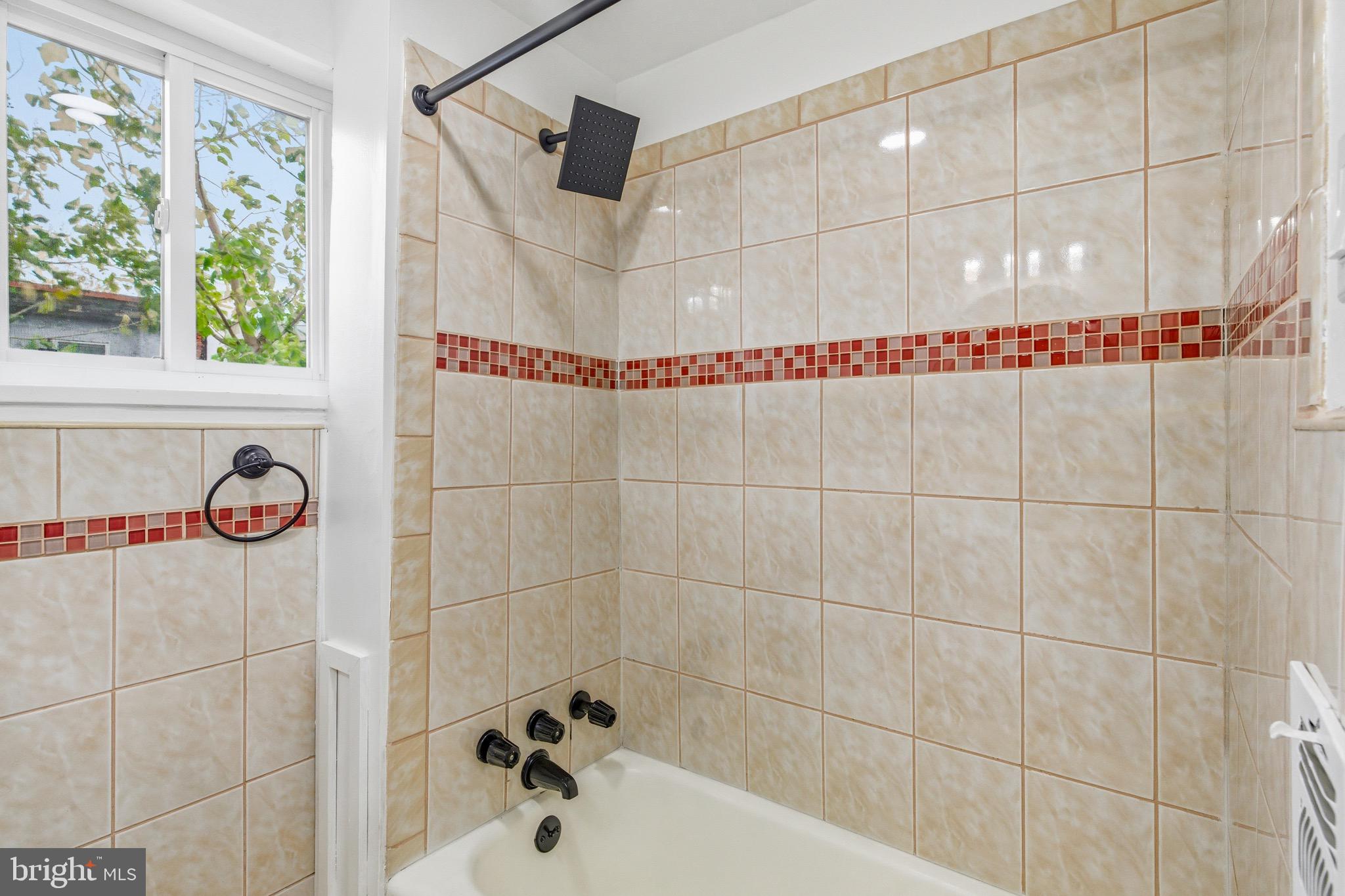 625 Cantrell Street Philadelphia, PA 19148 - Photo 9 of 15 a bathroom with a bathtub and shower
