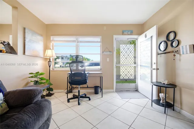 a living room with furniture and a window