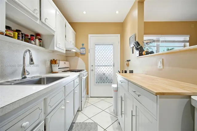 a kitchen with a sink cabinets and a counter top space