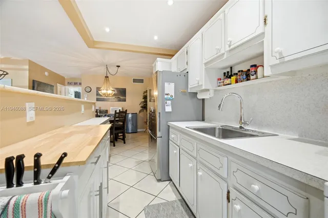 a view of a kitchen with cabinets