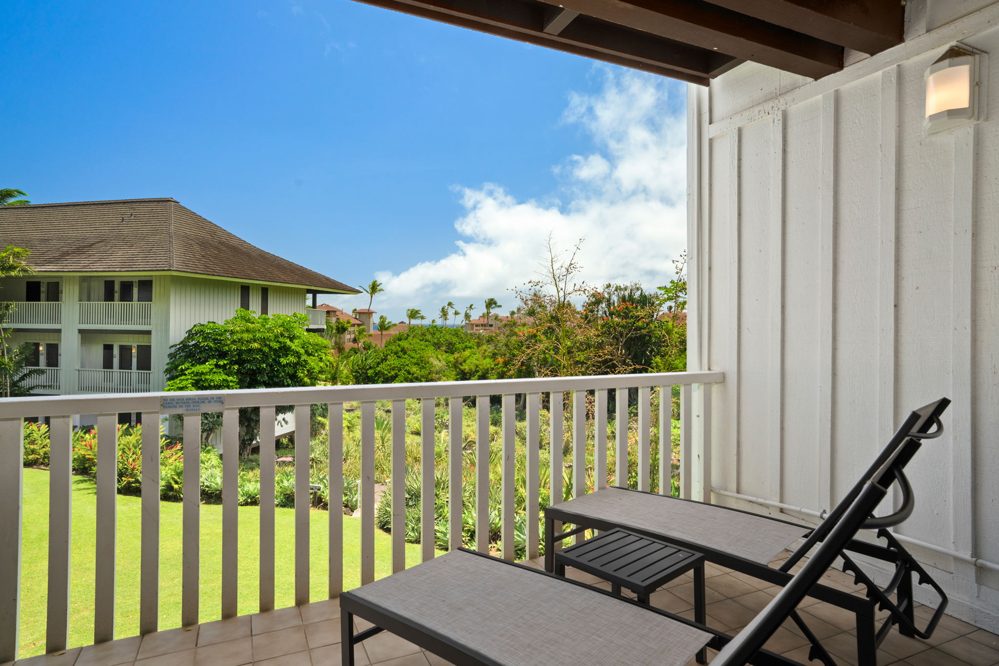 2253 Poipu Road, Unit 330 Koloa, HI 96756 - Photo 19 of 26 a view of a chair and table in the balcony