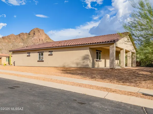 a view of a house with a parking space
