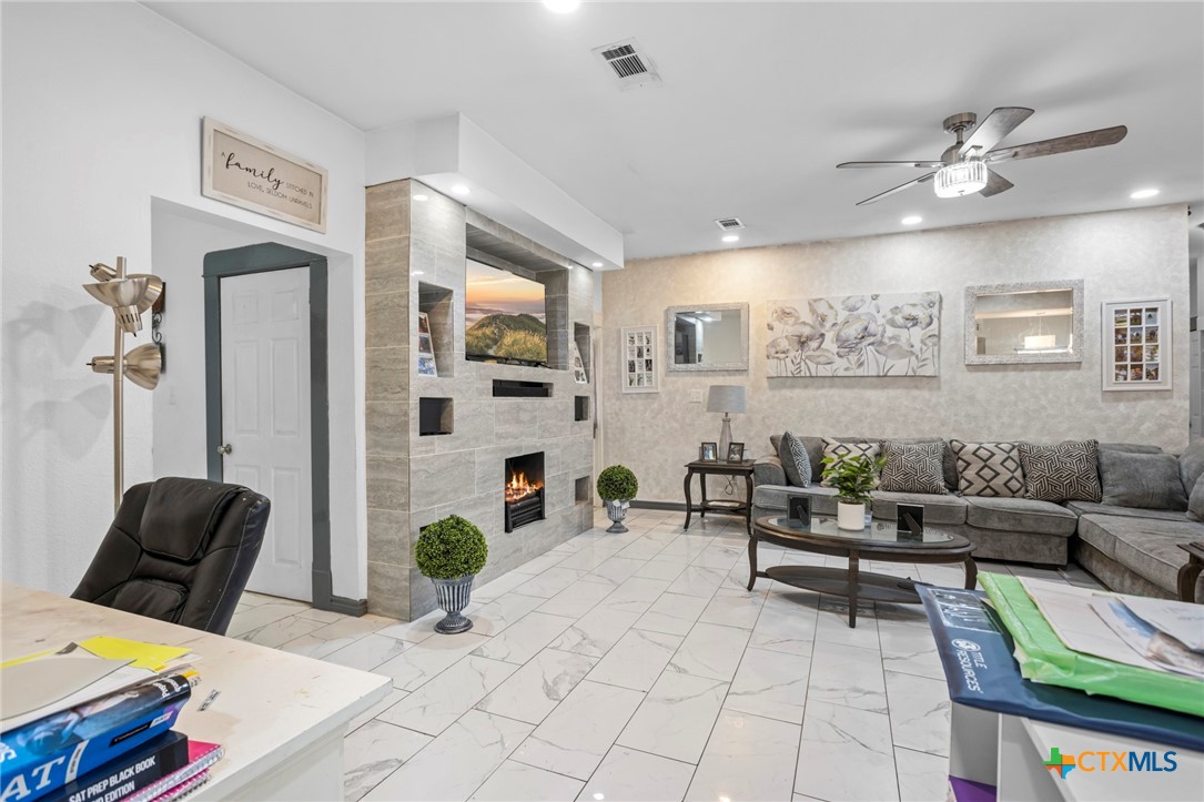 811 Ward Street Marlin, TX 76661 - Photo 14 of 31 a living room with furniture and a chandelier
