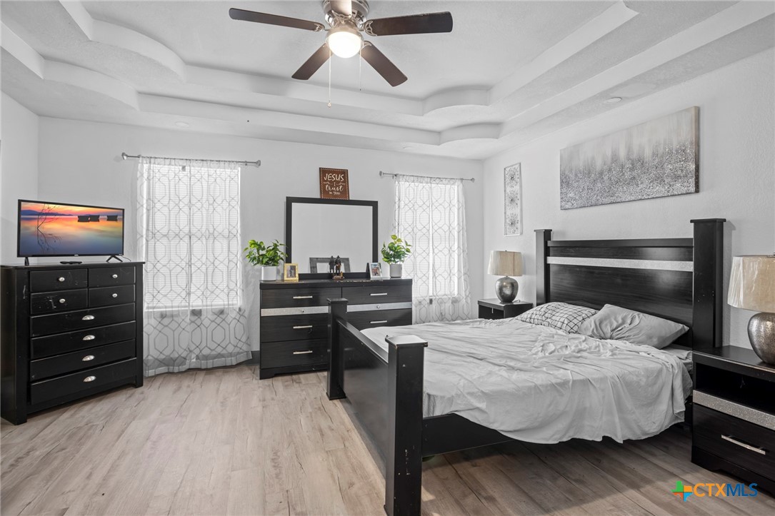 811 Ward Street Marlin, TX 76661 - Photo 21 of 31 a bedroom with a bed and a flat screen tv