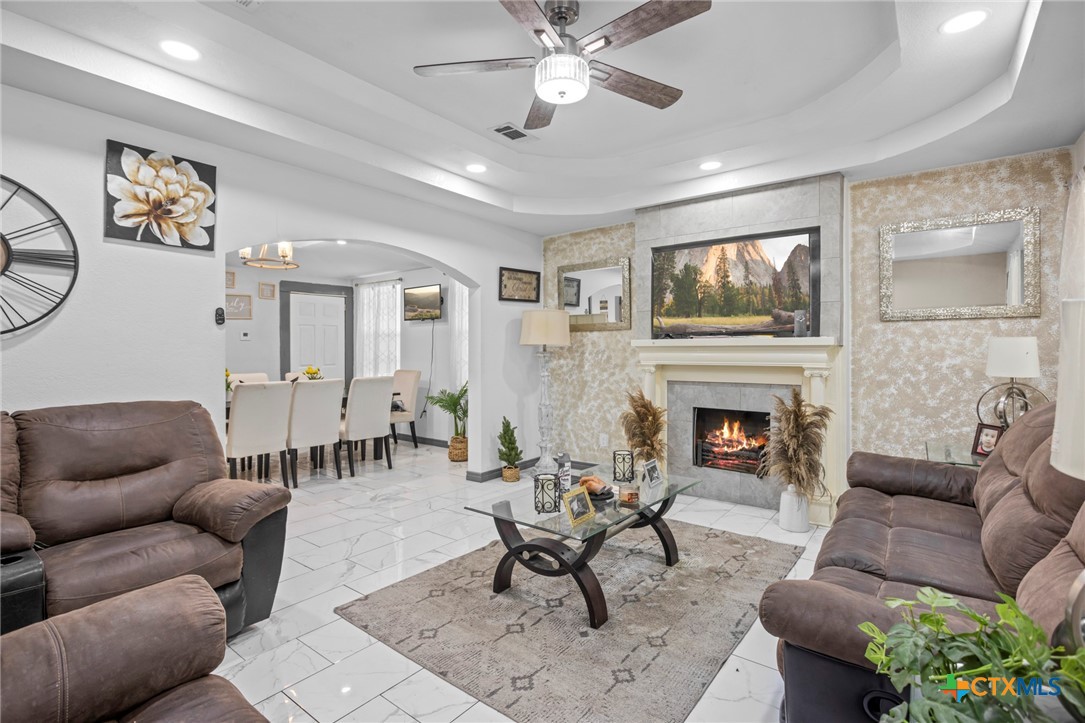 811 Ward Street Marlin, TX 76661 - Photo 6 of 31 a living room with furniture a flat screen tv and a fireplace