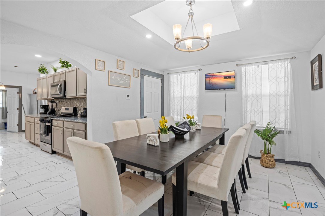 811 Ward Street Marlin, TX 76661 - Photo 7 of 31 a view of a dining room with furniture and chandelier