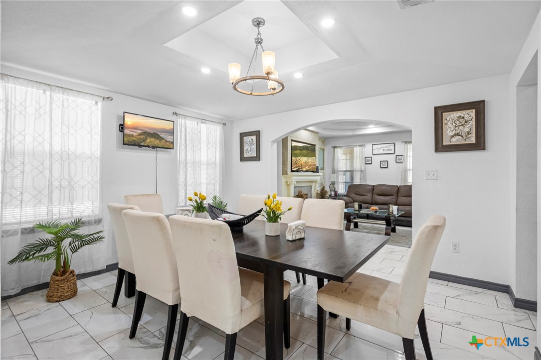 811 Ward Street Marlin, TX 76661 - Photo 9 of 31 a view of a dining room with furniture and chandelier