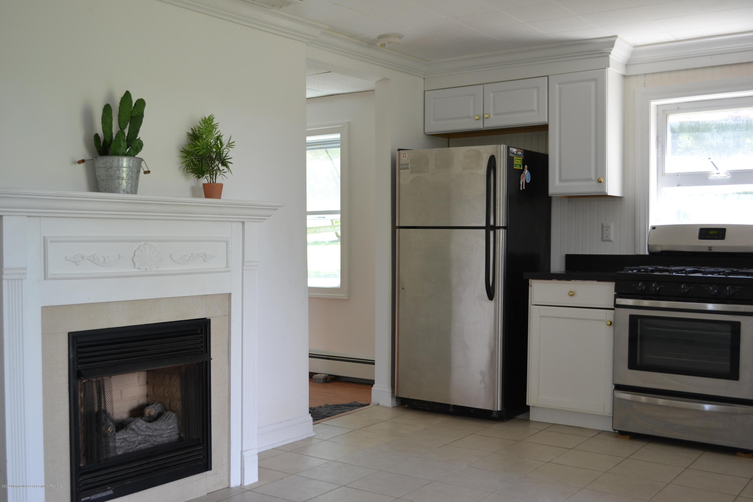 1167 Hedding Road Columbus, NJ 08022 - Photo 2 of 16 a kitchen with a refrigerator and a stove