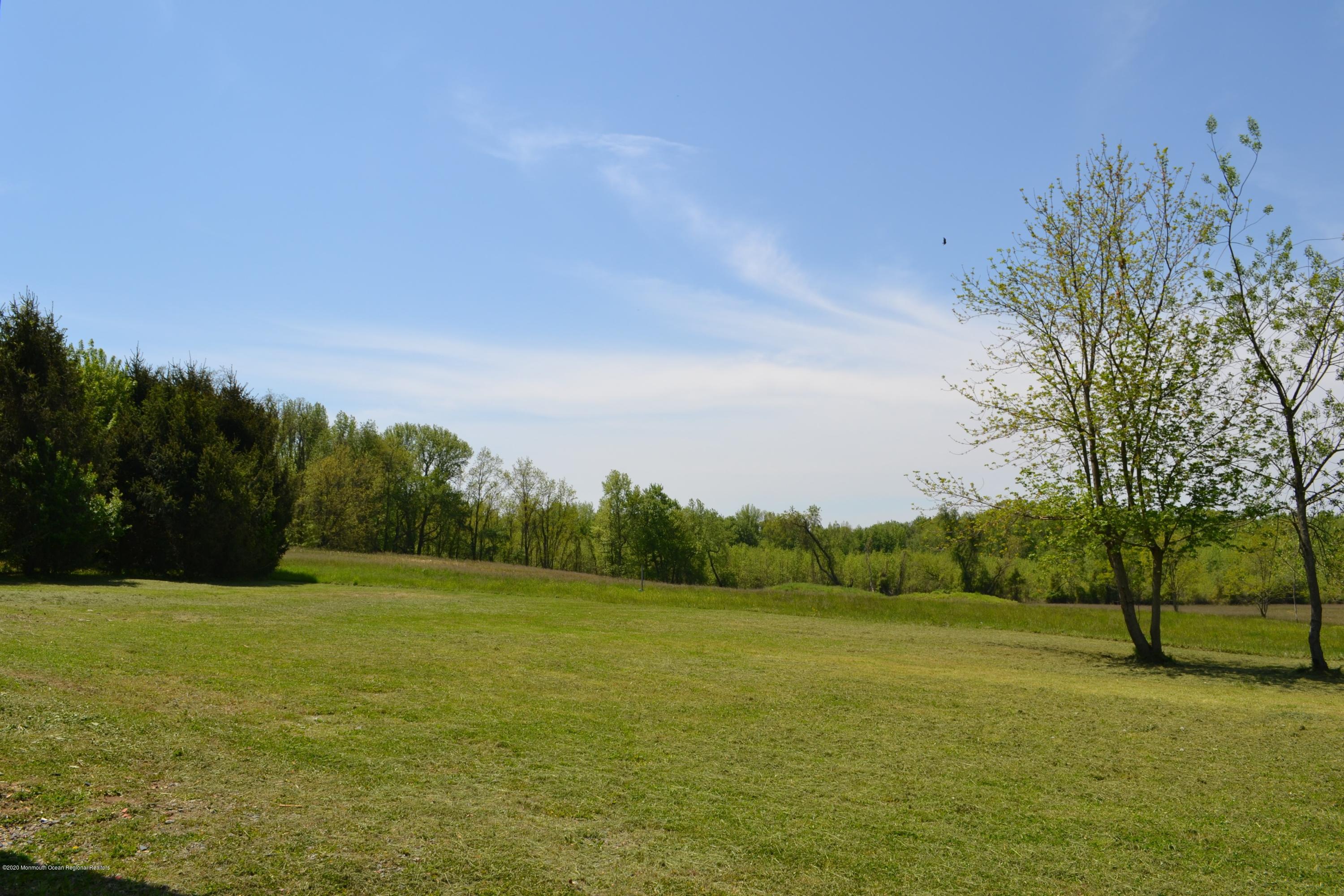 1167 Hedding Road Columbus, NJ 08022 - Photo 14 of 16 a view of a field with trees in background