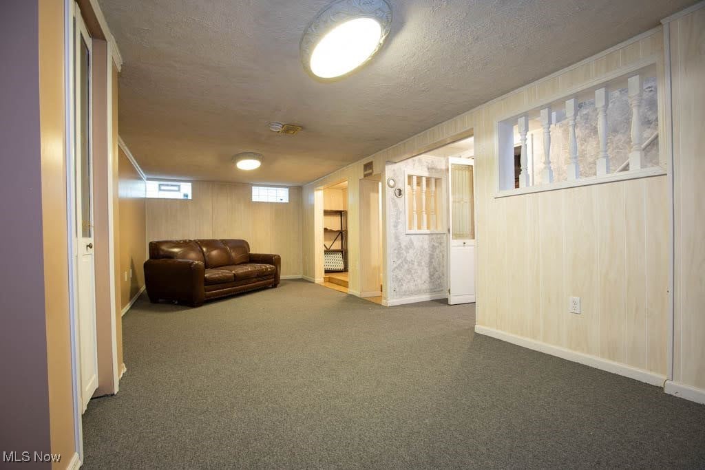12822 Grannis Road Cleveland, OH 44125 - Photo 21 of 44 Unfurnished room with carpet and a textured ceiling