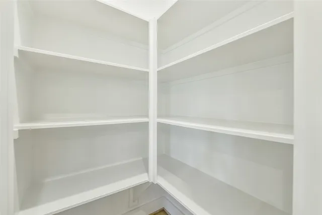 a bathroom with a sink a large mirror and a light fixture