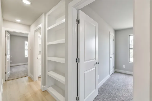 a view of a bathroom with a glass door shower