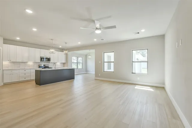 a view of kitchen with wooden floor and window
