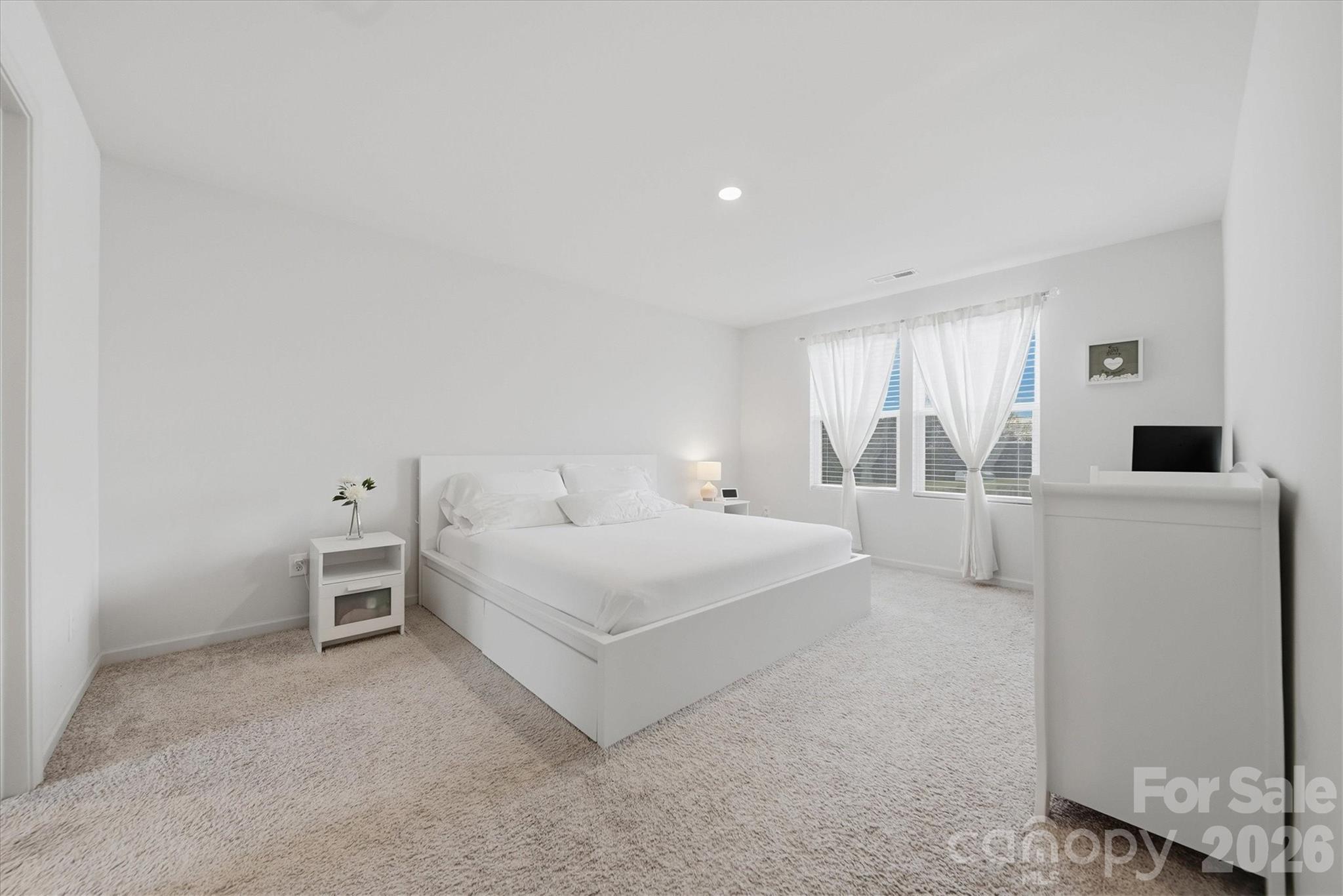 4484 Springs Road Conover, NC 28613 - Photo 13 of 32 a large white bed in a white room