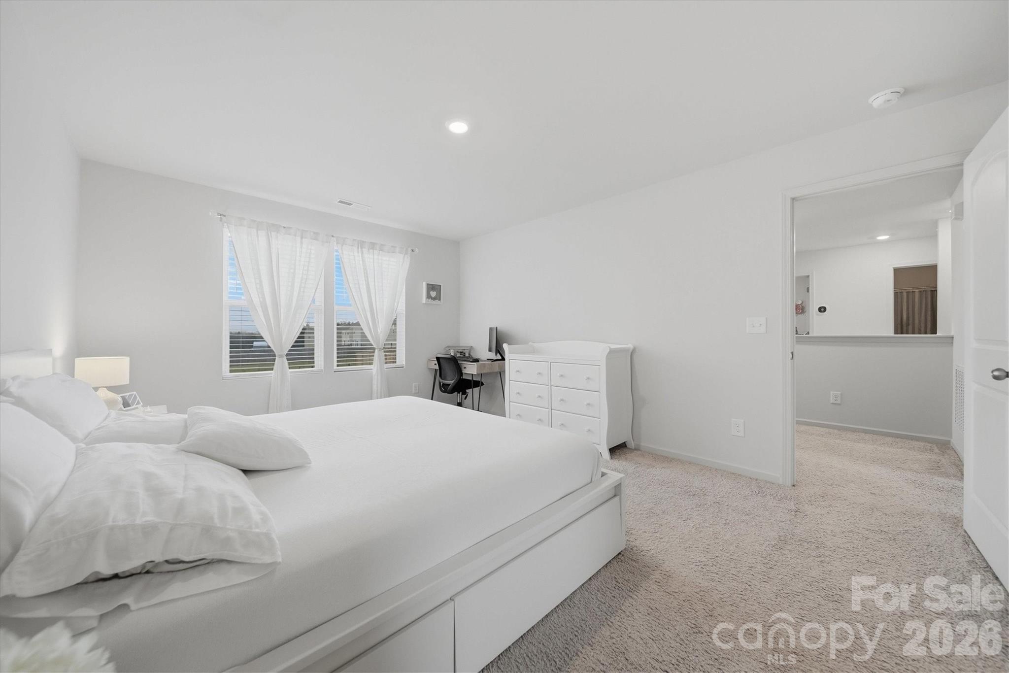 4484 Springs Road Conover, NC 28613 - Photo 16 of 32 a bedroom with a bed and a large window