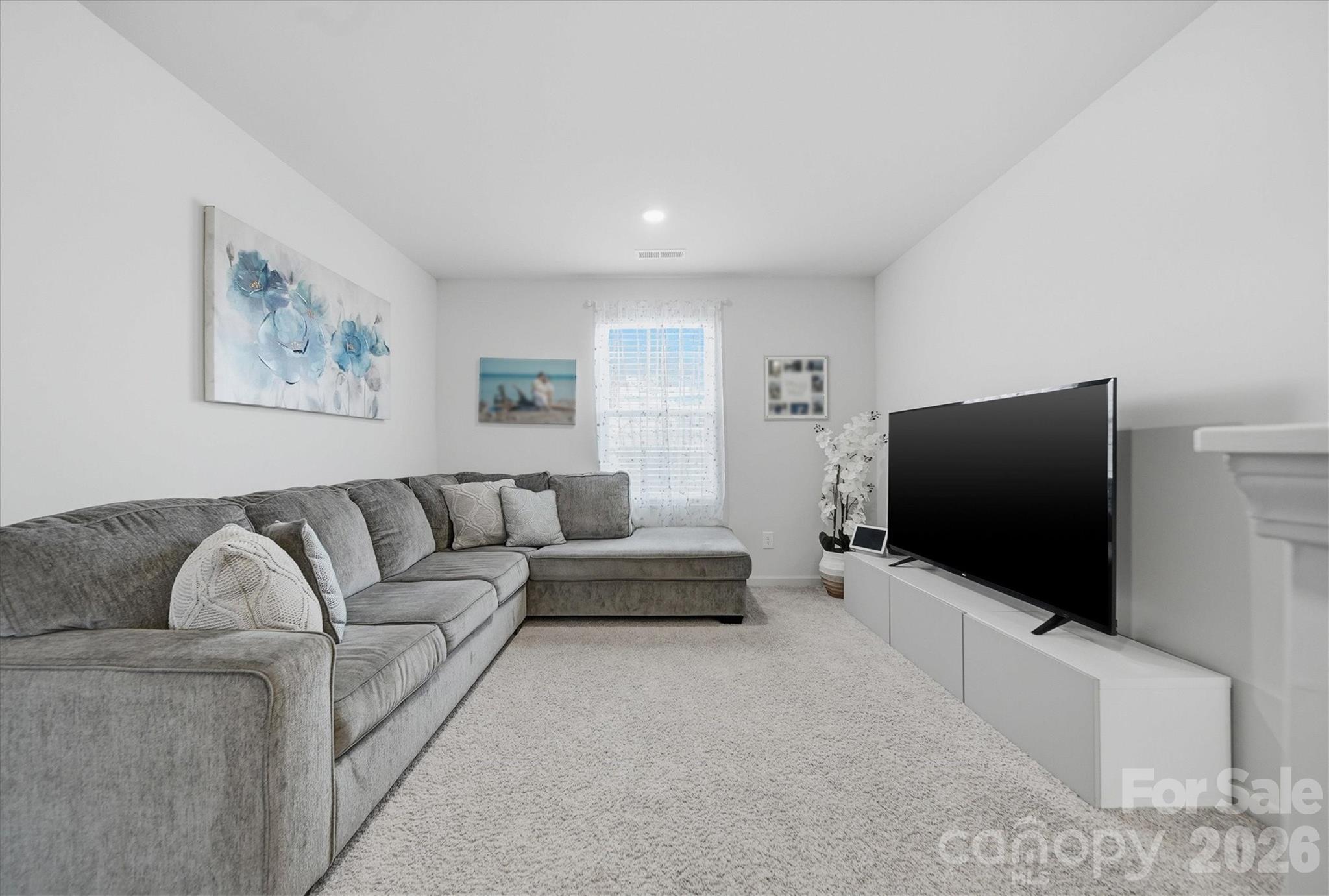 4484 Springs Road Conover, NC 28613 - Photo 18 of 32 a living room with furniture and a flat screen tv