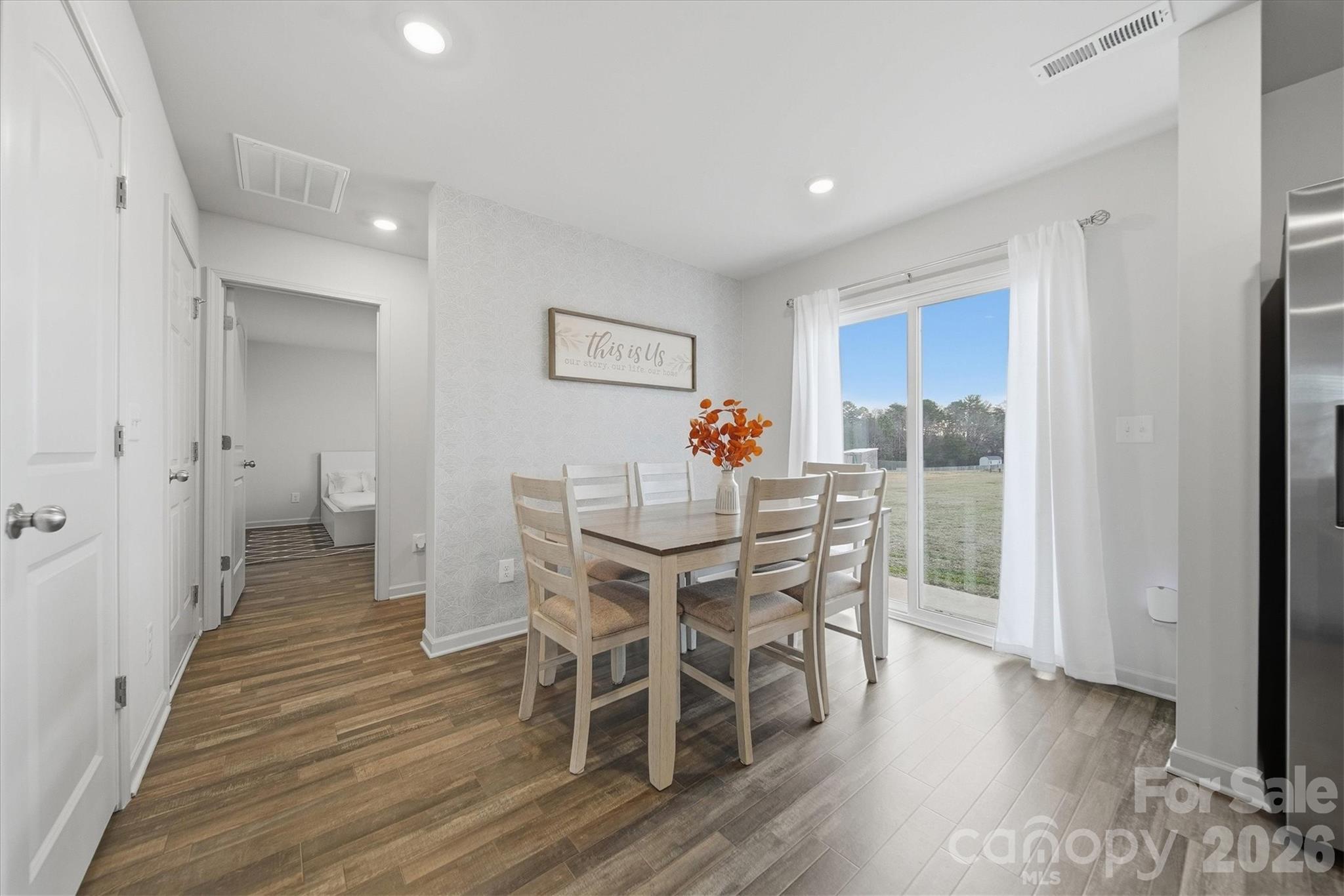 4484 Springs Road Conover, NC 28613 - Photo 6 of 32 a view of a dining room with furniture and wooden floor