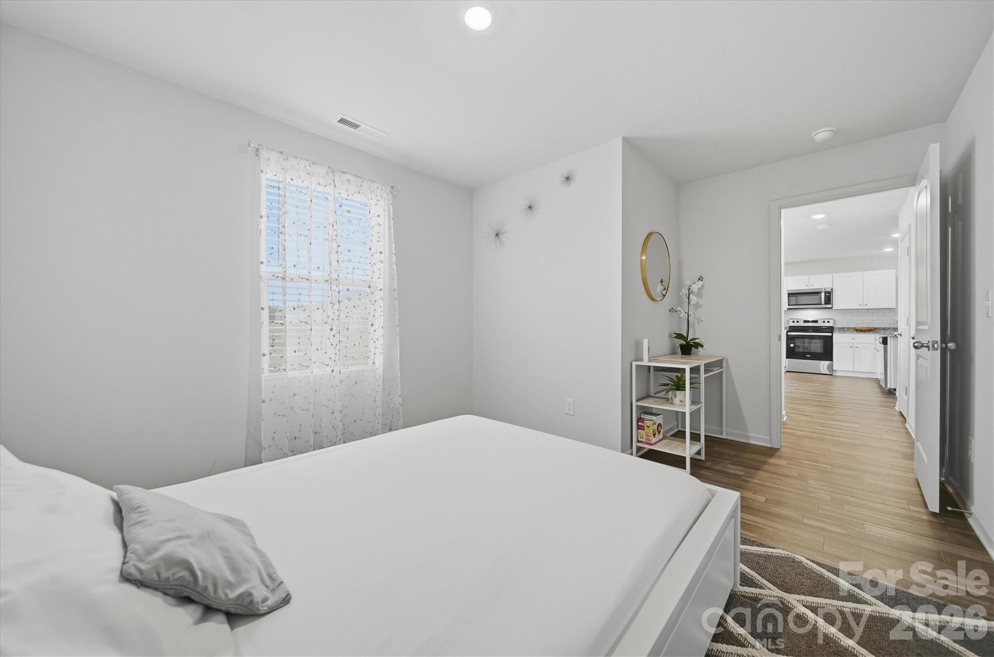 4484 Springs Road Conover, NC 28613 - Photo 9 of 32 a bedroom with a bed and a table in it