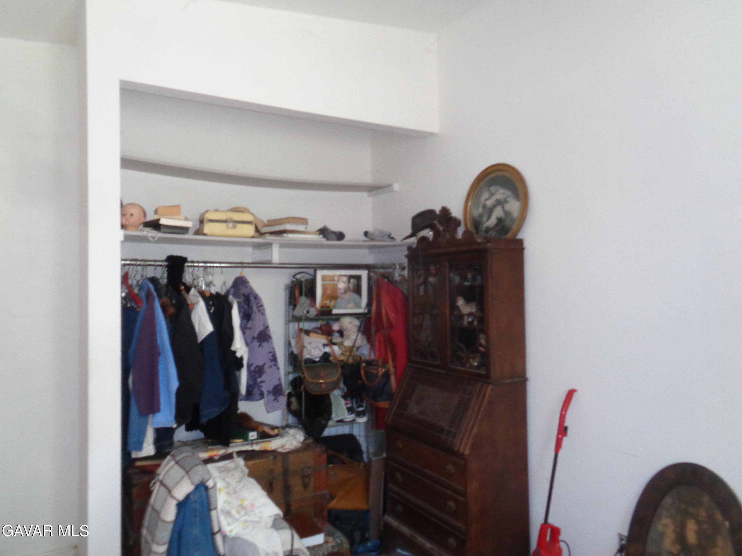 9728 Aveune S10 Street East Littlerock, CA 93543 - Photo 15 of 45 a view of walk in closet with clothes