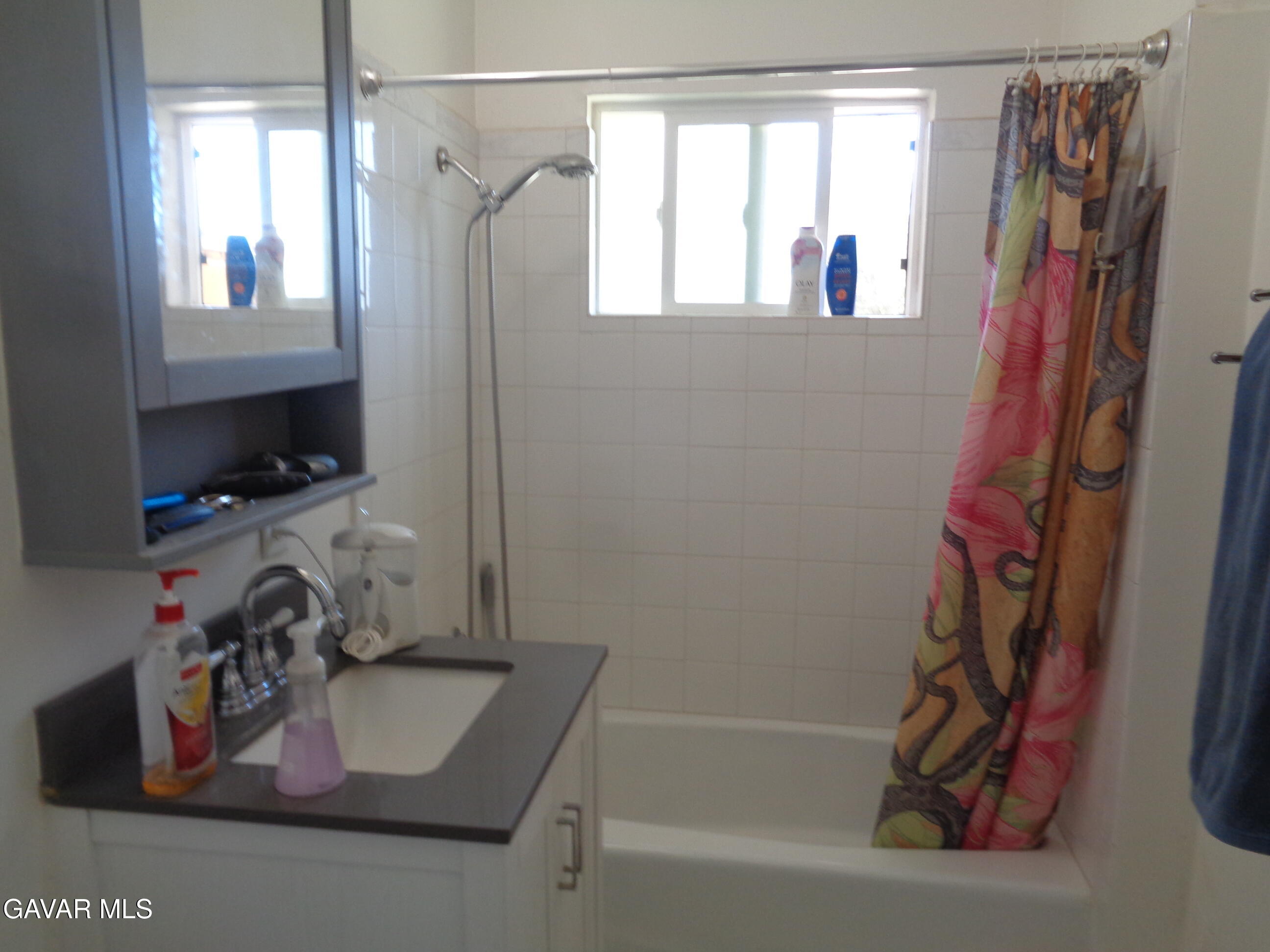 9728 Aveune S10 Street East Littlerock, CA 93543 - Photo 18 of 45 a bathroom with a tub and a sink