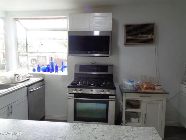 a living room with washer and dryer
