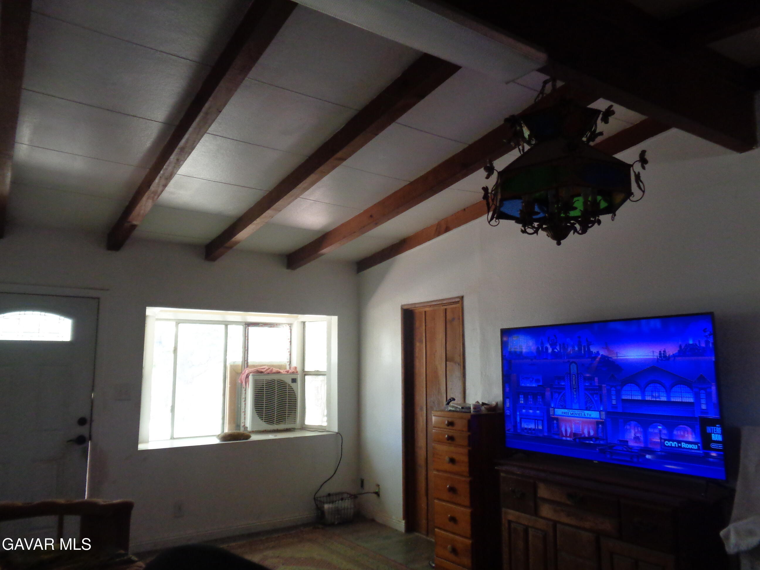 9728 Aveune S10 Street East Littlerock, CA 93543 - Photo 34 of 45 a living room with red couch
