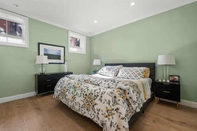 a bedroom with a bed and a lamp on table