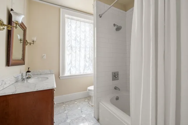 a bathroom with a bathtub and a sink