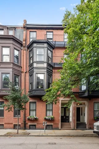 a view of a building with a tree