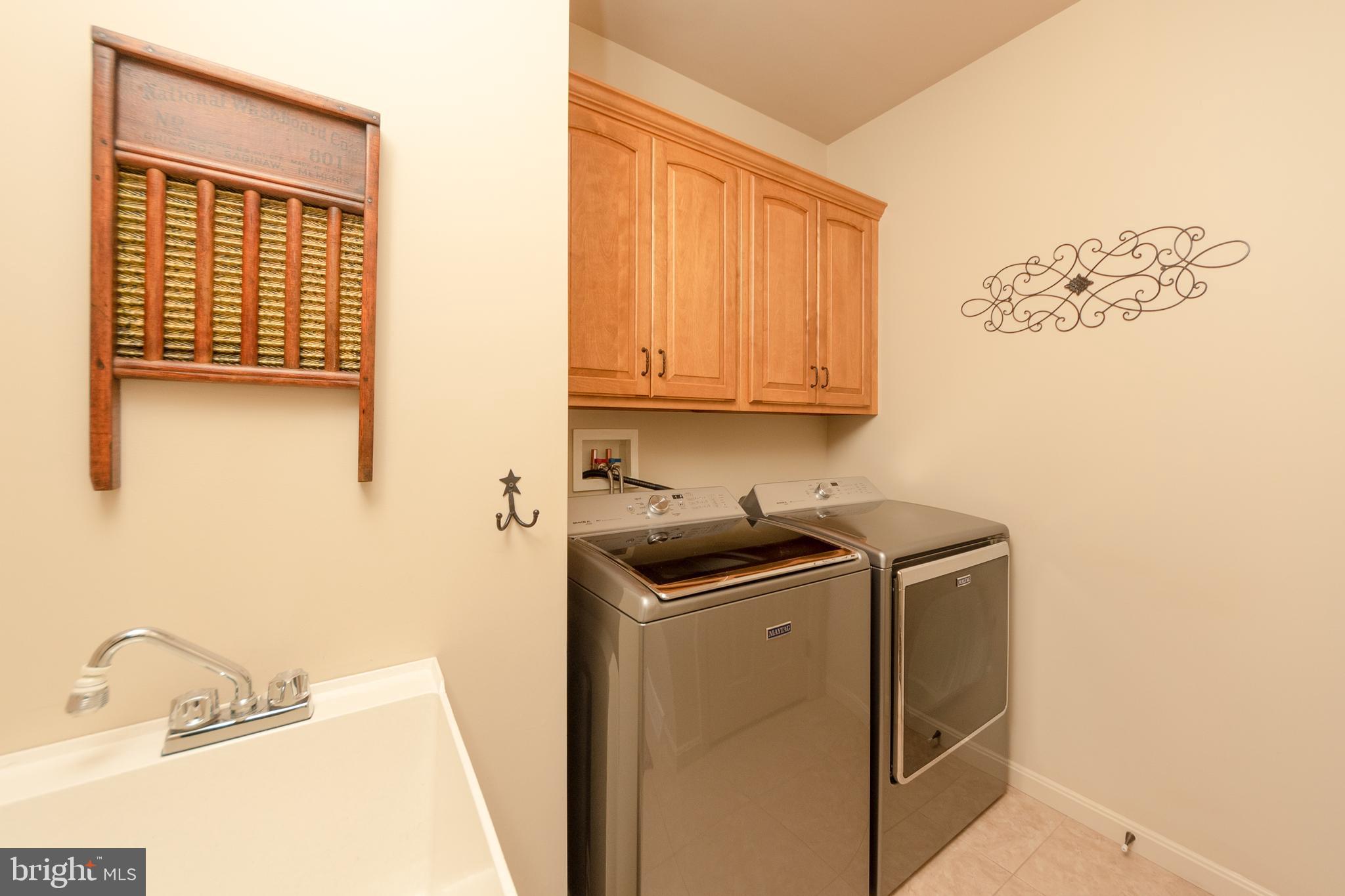223 Rock Point Road Marietta, PA 17547 - Photo 21 of 63 Laundry Room has storage and a laundry sink.