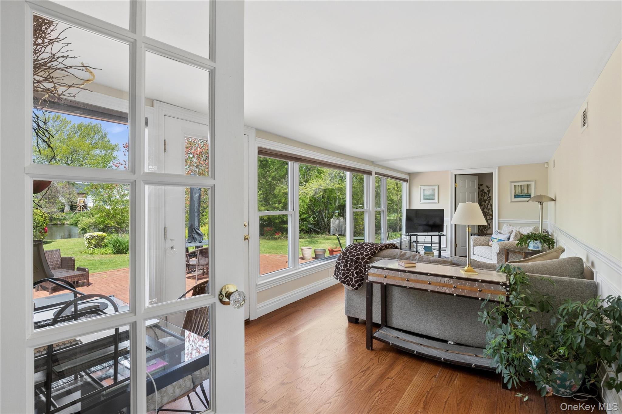 50 Belton Road Babylon, NY 11702 - Photo 16 of 34 This 4 Season Sunroom is a relaxing retreat with beautiful hardwood floors, a full bank of windows to enjoy the outside gardens and pond views. Plus a work area for those who work from home.