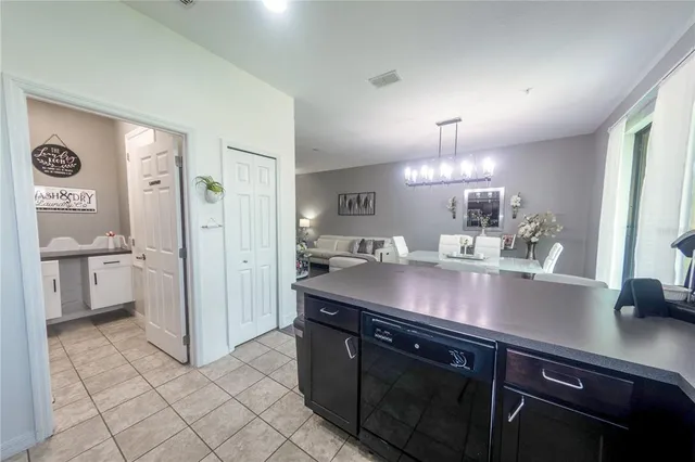 a kitchen with stainless steel appliances granite countertop a sink and a stove