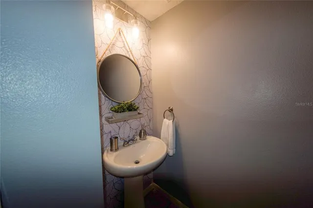 a bathroom with a toilet and a sink