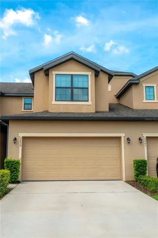 a front view of a house with garage