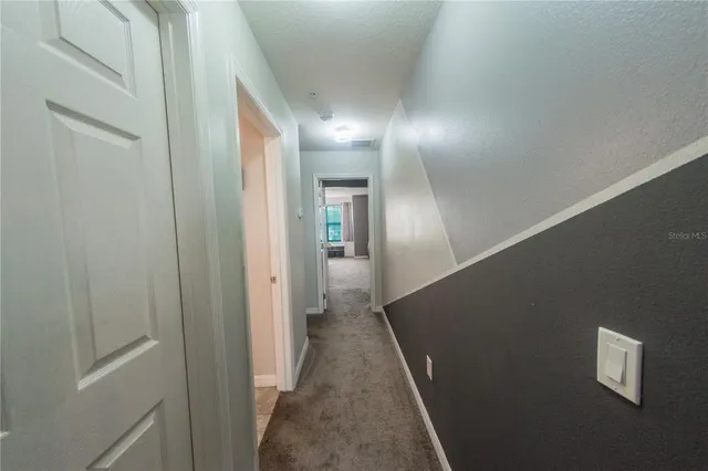 a bedroom with bed and a window