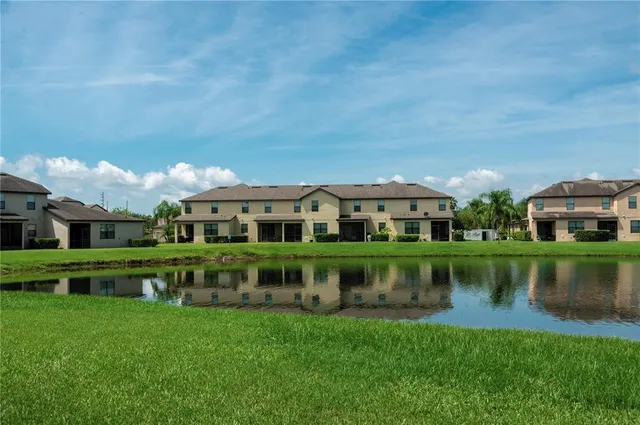 a front view of a house with a yard table and chairs