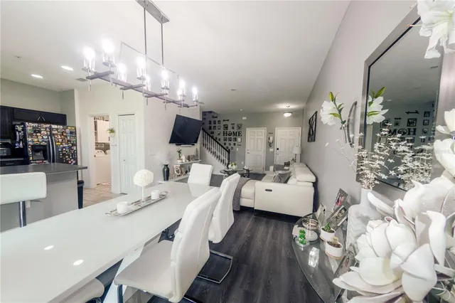 a very nice looking dining room with a table and chairs