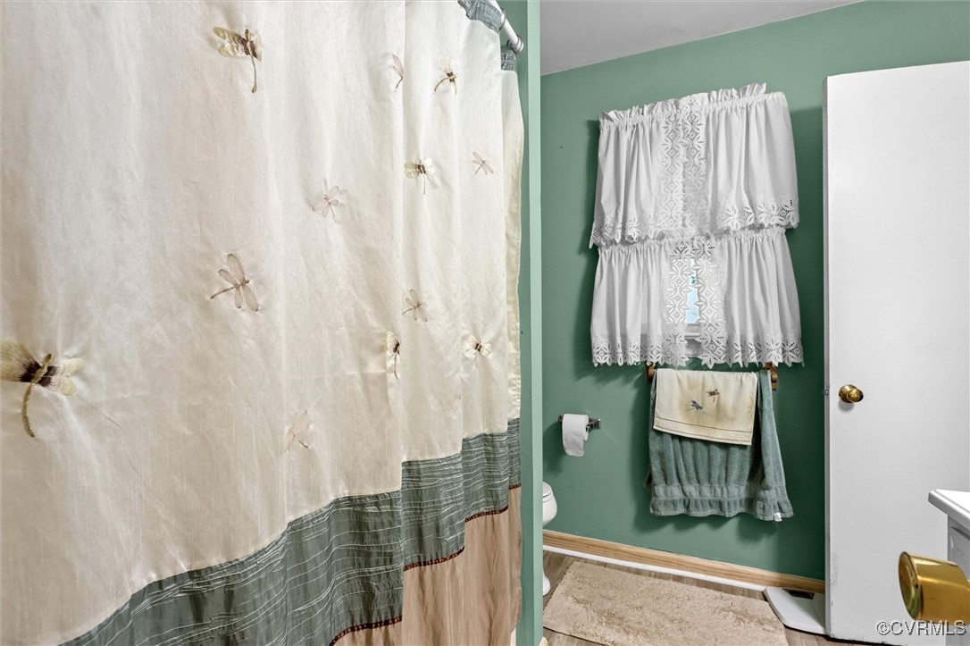 7306 Full Rack Drive Midlothian, VA 23112 - Photo 18 of 32 Full bathroom with toilet and a shower with curtai