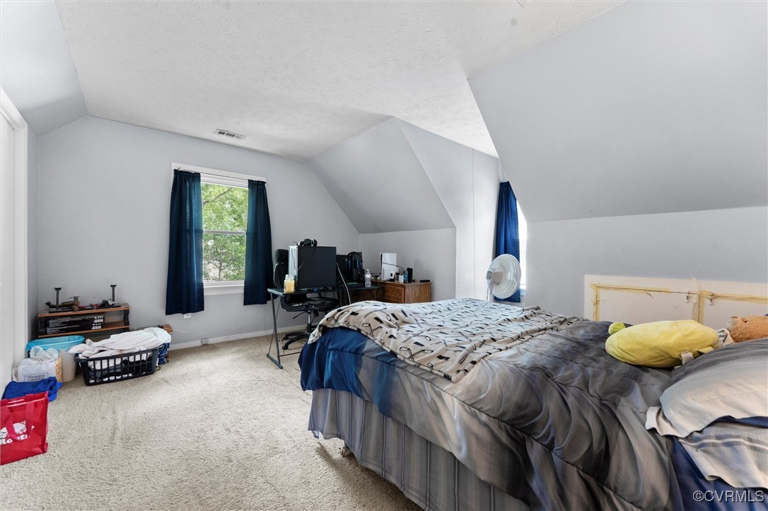 7306 Full Rack Drive Midlothian, VA 23112 - Photo 23 of 32 Carpeted bedroom with vaulted ceiling and a desk