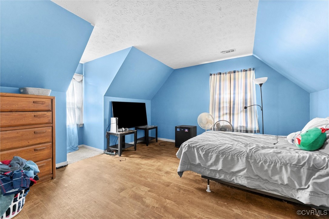 7306 Full Rack Drive Midlothian, VA 23112 - Photo 26 of 32 Bedroom featuring wood finished floors and vaulted