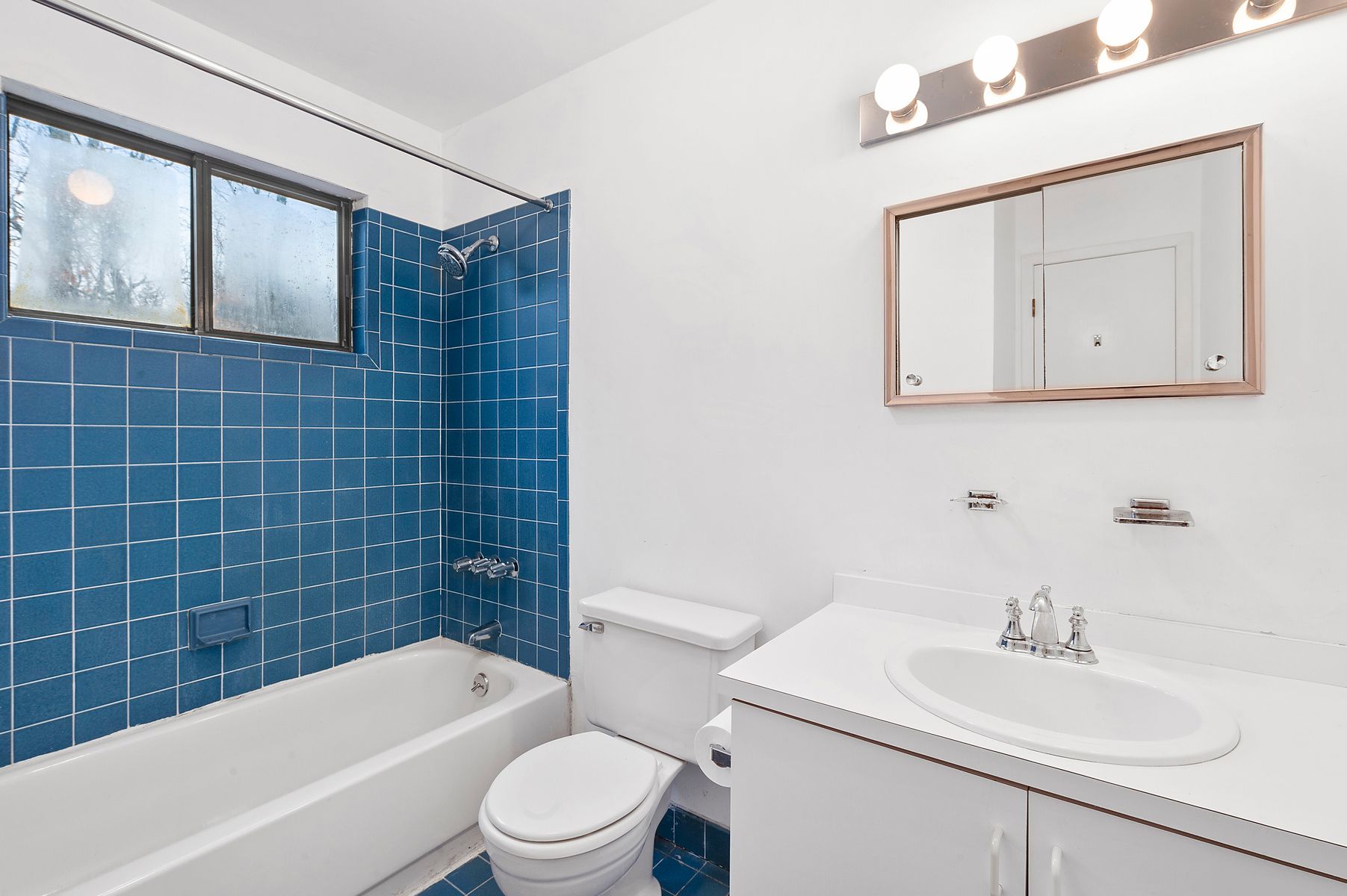 141 Roses Grove Road Southampton, NY 11968 - Photo 5 of 9 a bathroom with a sink toilet a mirror and bathtub