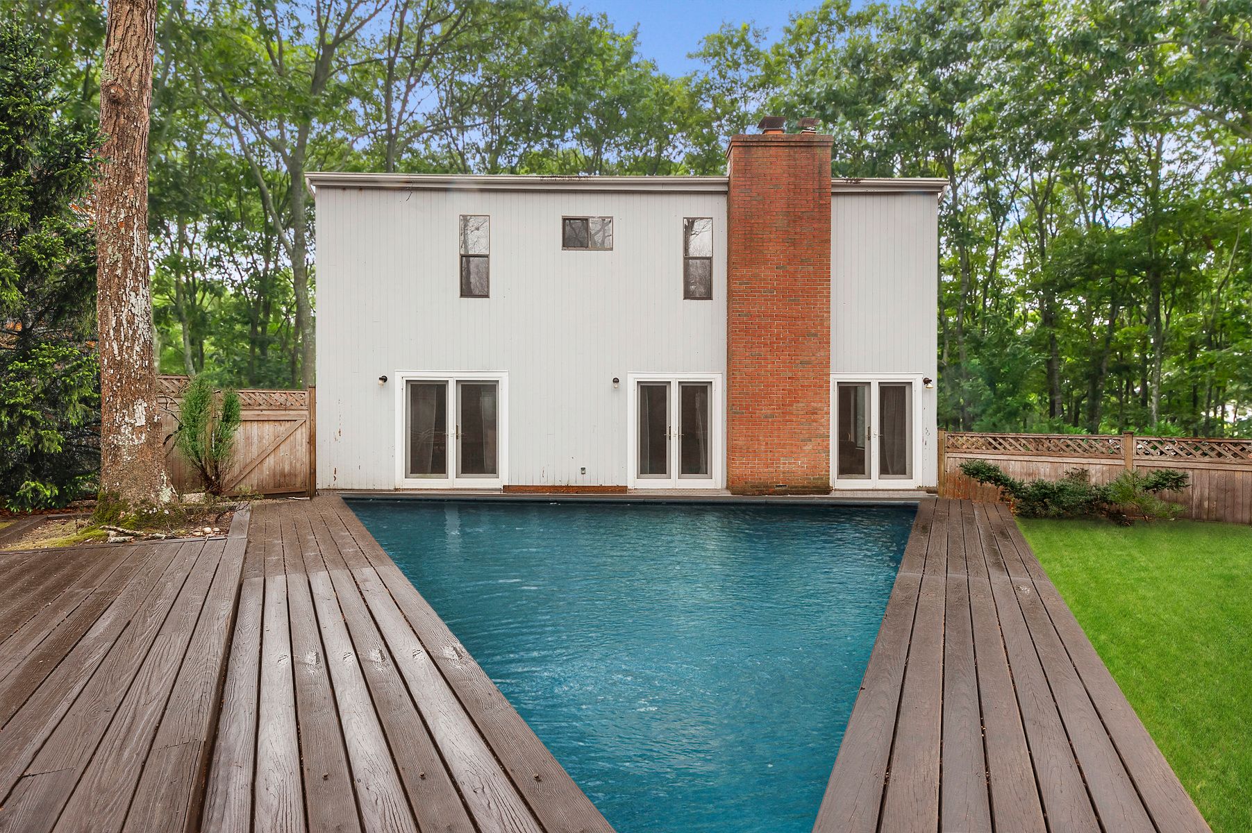 141 Roses Grove Road Southampton, NY 11968 - Photo 8 of 9 a view of a house with backyard