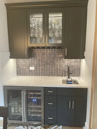 a kitchen with a sink and cabinets