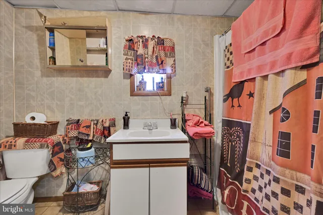 a bathroom with a shower and a sink