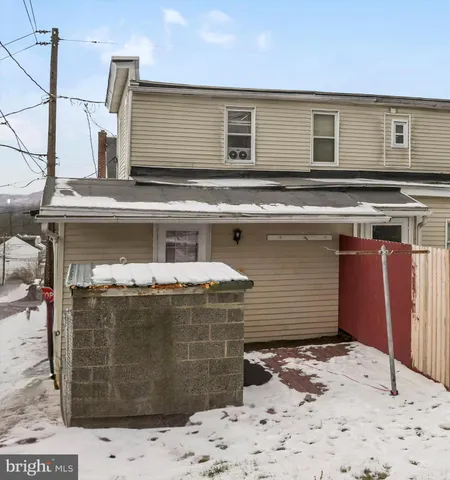 a view of a house with a street