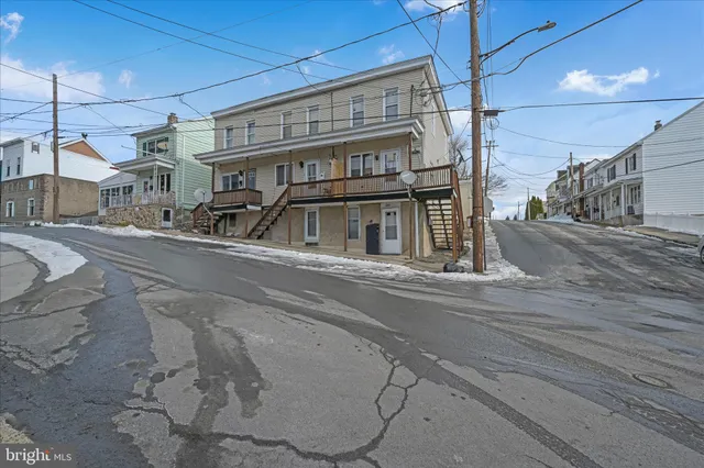 a view of a building with a street