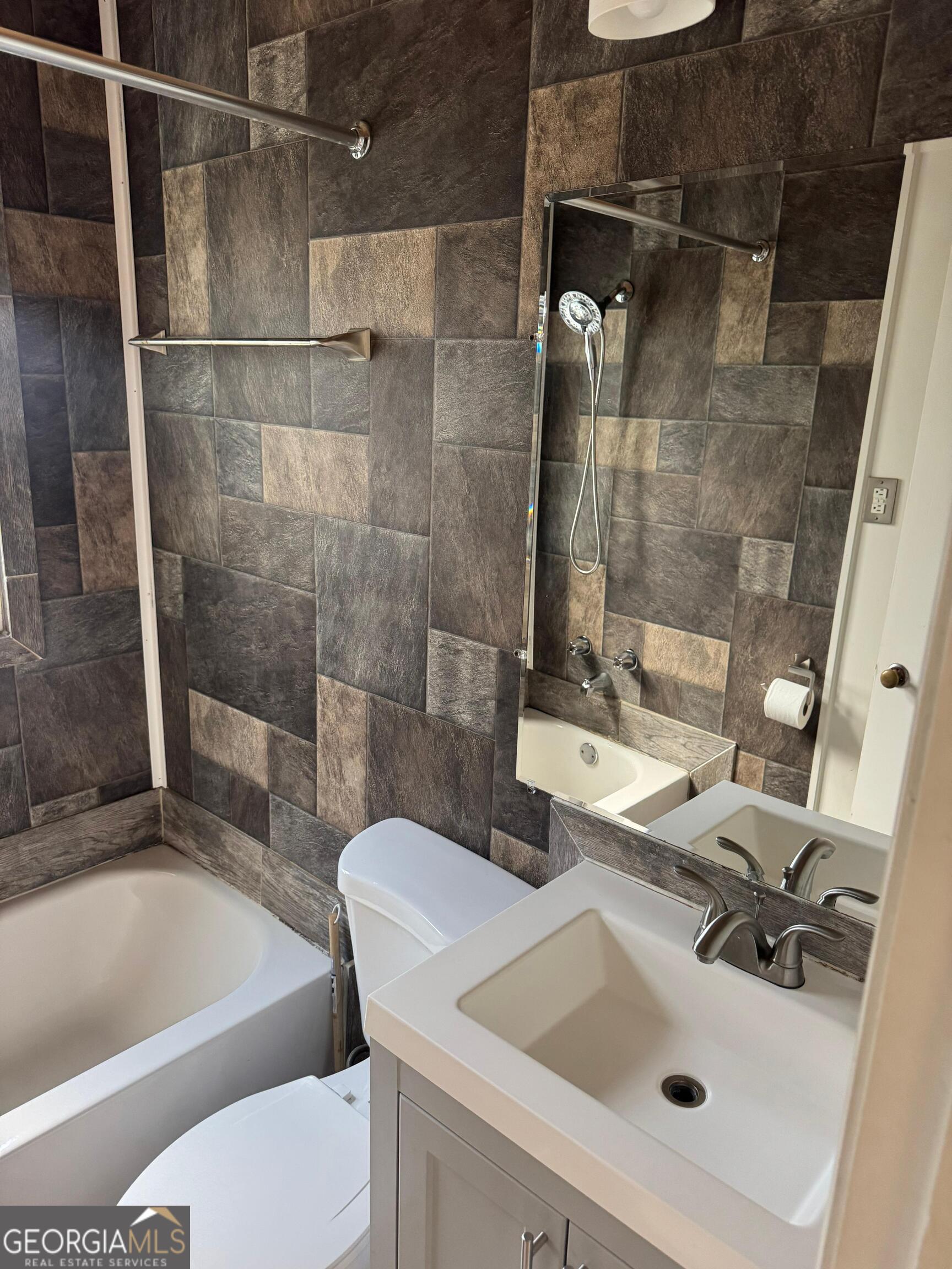609 West Main Street Thomaston, GA 30286 - Photo 23 of 27 a bathroom with a sink toilet and shower