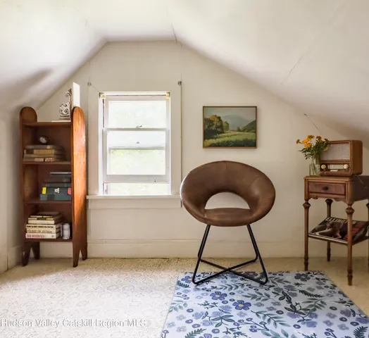 a workspace with furniture and a window