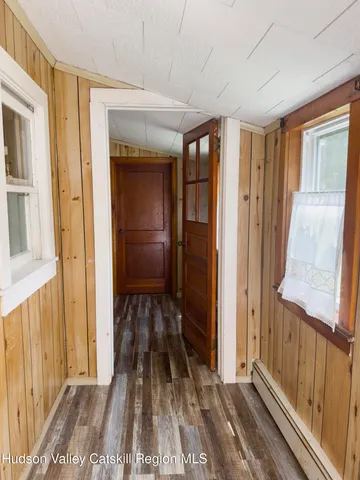 a view of a room with wooden floor and stairs