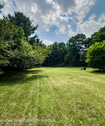 a view of a garden and basketball court